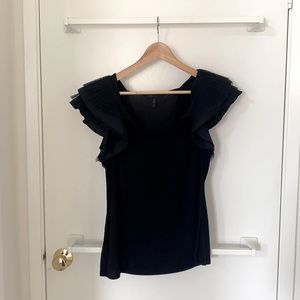 Black top BCBG with ruffles and slightly padded shoulders. Size M